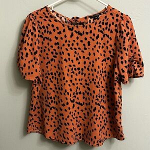 Orange printed shortsleeved blouse with back tie